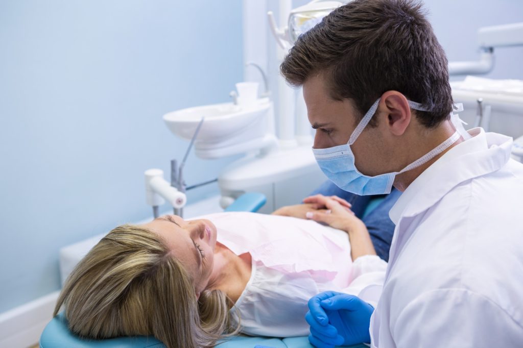 Close up of doctor talking with patient