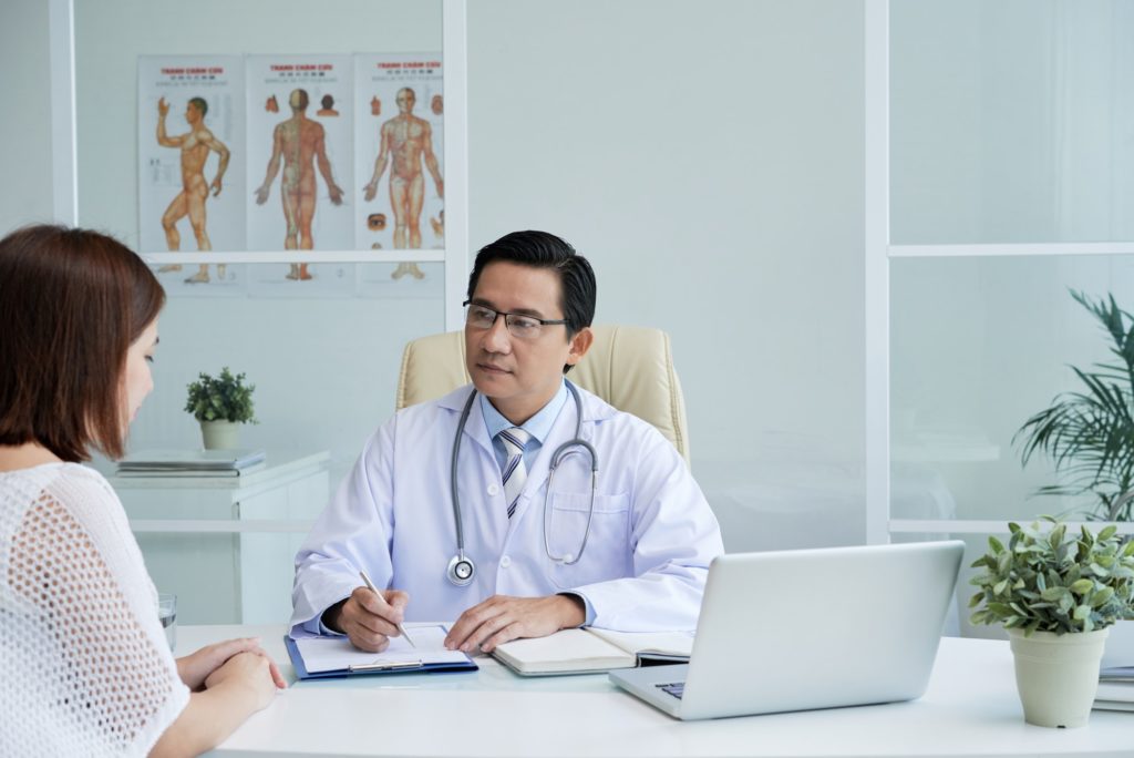 Doctor listening to patient